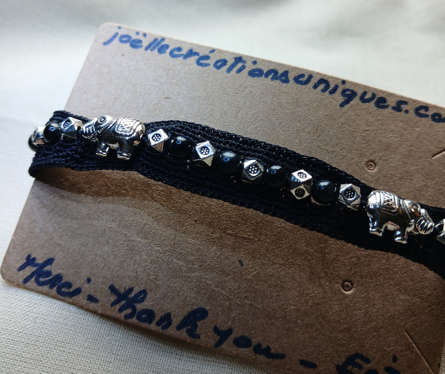 Bracelet noir œil de faucon et éléphants argent